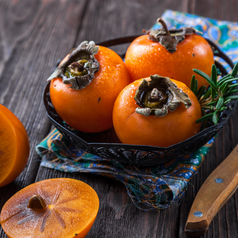 Persimmons on table